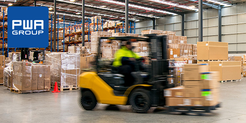 Forklift working at logistics warehouse